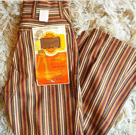 The dreamiest bell bottoms we ever did see!! Authentic vintage, 1970's, Wrangler brand Gorgeous orange, brown, and gold stripe tones Flared leg With groovy original page from the 70's Super RARE and rad vintage find! Good pre-loved vintage condition 100 % cotton Original Tag reads: Authentic 70s Outfits, Authentic 70s Fashion, Striped Bell Bottoms, 1970s Glam, 70’s Aesthetic, 70s Inspired Fashion, 70s Outfits, 70’s Fashion, Hippie Costume