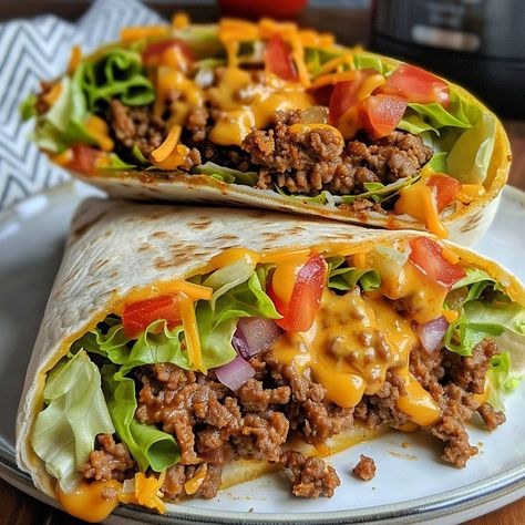 🌮🥩 Wrap up your cravings with this cheesy sensation! #NachoCheeseWrap #BeefyBites 🍽️ Nacho Cheese Beef Wrap 🛒 Ingredients: 1 lb ground beef 1 packet taco seasoning 1 cup nacho cheese sauce 1 cup shredded lettuce 1 cup diced tomatoes 1 cup shredded cheddar 4 large tortillas 👩‍🍳 Instructions: Cook Beef: In a skillet, cook ground beef with taco seasoning until browned. Assemble Wraps: Spread nacho cheese sauce on tortillas. Add beef, lettuce, tomatoes, and cheddar. Wrap & Serve: Fold tortill... Breakfast With Ground Beef, Nacho Cheese Beef Wrap, Ground Beef Tortilla, Burritos Beef, Healthy Wrap, Creamy Garlic Mashed Potatoes, Enchiladas Healthy, Beef Wraps, Tortilla Wrap