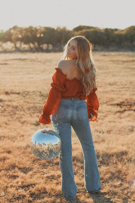 Western Disco Photoshoot, Senior Pictures Disco Ball, Boho Disco Photoshoot, Disco Ball Photoshoot Outside, Poses With Disco Ball, Disco Senior Pictures, Disco Photoshoot Ideas, 70s Inspired Senior Pictures, Western Photoshoot Ideas Outfit