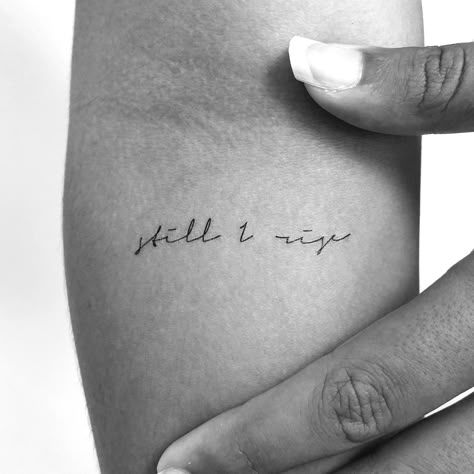 Handwritten script 'still I rise' temporary tattoo. Set of three. Size: 2 in / 5 cm (height). Tatteco temporary tattoos last on average 2-5 days (We suggest placing on oil-free areas where skin does not stretch and keep them clean), and are: - Environmentally friendly (tattoos and packaging made out of paper, no plastic layer) - Safe & non-toxic. - FDA-compliant and fun for all ages. Thank you for reading! Still She Rises Tattoo, Still We Rise Tattoo, And Yet I Rise Tattoo, Free At Last Tattoo, Best Tattoo Places For Women, Rising Above Tattoo, Still I Stand Tattoo, Tattoos About Rising Up, Stay Calm Tattoo