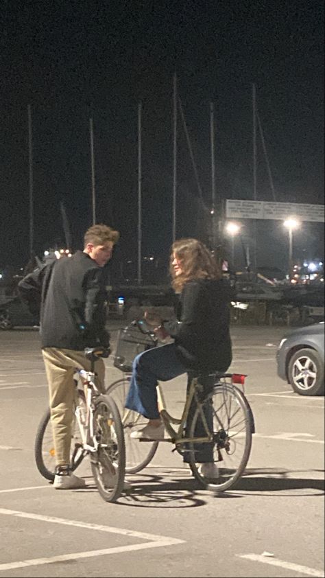 #aesthetic #art #bike #parking #night #photography Cycling Date Aesthetic, Couple Riding Bike Aesthetic, Cycling Couple Aesthetic, Bike Date Aesthetic, Along For The Ride Aesthetic, Boy Riding Bike Aesthetic, Couple Bicycle Aesthetic, Bike Couple Aesthetic, Riding Bicycle Aesthetic