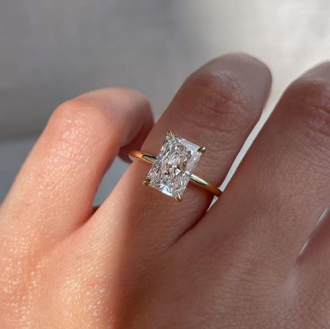 3.31 CT Elongated Radiant Cut Moissanite Ring_Solitaire Ring_14k Solid Yellow Gold_Hidden Halo_Minimalist Gold Jewelry_Lovely Gift For Bride ❤ ITEM DETAILS:- ✦ Brand: The American Gold House (TAGH) ✦ Handmade, high-quality item! ✦ Material: Solid 10K/14K/18K Gold, 950 Platinum and 925 Sterling Silver ✦ Diamond Type: Moissanite Diamond ✦ Diamond Cut: 10x7 MM Elongated Radiant ✦ Diamond Weight: 3.31 CT Radiant ✦ Main Stone Color: Colorless ✦ Width of Band: 1.6 MM (Bottom) ✦ Diamond Clarity: VVS/VS ❤ ACCENT/HALO DIAMONDS:- ✦ Side Stone Material: Moissanite Diamond ✦ Side Stone Shape: Round Cut ✦ Side Stone Carat Weight: 0.18 CT ✦ Side Stone Color: Colorless ✦ Diamond Clarity: VVS/VS ------------------------------------------------------------------------------ 💎 Moissanite VS Diamond 💎 ---- Gold Band With Rectangle Diamond, Simple Radiant Engagement Rings, Low Set Radiant Engagement Ring, Gold Engagement Ring Diamond Band, Oval Vs Radiant Engagement Ring, Moissanite Engagement Ring Rectangle, 3ct Radiant Engagement Ring, Gold Square Ring, Princess Cut Moissanite Engagement Ring