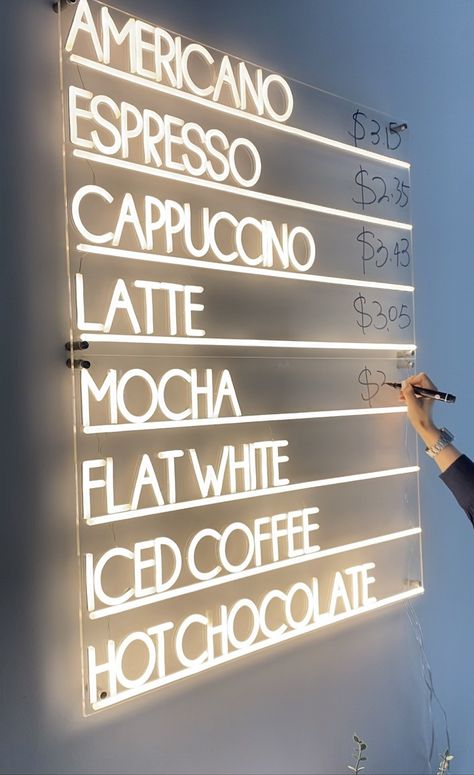 Are you a coffee lover or do you own a coffee shop? If your answer is yes, then you’ll love our coffee menu neon sign. This neon sign is designed for coffee lovers and it features 8 customer-favorite coffee drinks all lit with vibrant LED bulbs.  The coffee menu neon sign is handcrafted from transparent PVC tubes giving the neon sign ultra-durability and a lightweight frame. These features make the coffee menu neon safe to use and easy to install in coffee shops and by your coffee table at home. Cafe Table Decor Coffee Shop, Classy Restaurant Design, Ice Cream Shop Menu Design, Cafe Shop Ideas, Greenhouse Coffee Shop, Boho Coffee Shop Interior Design, Coffee Shop Inspiration, Neon Signs Cafe, Unique Cafe Design