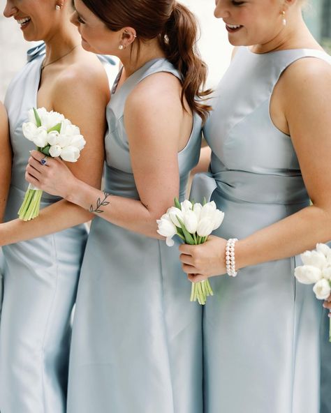 A blue and white wedding at Omni Barton Creek with dusty blue satin bridesmaids dresses, tulip bouquets, and all white flowers | Julie Wilhite Photography - Austin Wedding Photographer Tulip Bouquets For Bridesmaids, Light Blue Bridesmaid Bouquet, Blue And White Bridesmaid Bouquet, Bridesmaid Bouquet Blue, Tulip Bridesmaid Bouquet, White Tulip Wedding, White Bridesmaids Bouquets, Wedding Bouquets Bridesmaids, Satin Bridesmaids Dresses