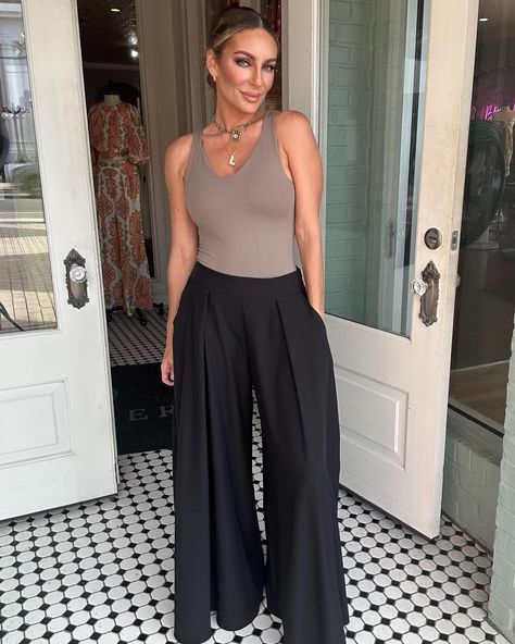 Made for comfort and style, these Ashley Wide Leg Pants provide a flattering fit and give you the freedom to move (and groove) all day long. #womensclothingboutique #widelegpants #dresspants #comfortstyle #boutiqueclothing Wide Leg Pants With Bodysuit Outfit, Flowy Work Pants, Black Satin Wide Leg Pants Outfit, Black Wide Leg Pants Outfit Summer, Flowy Pants Outfit Dressy, Black Pants Outfit Dressy, Plus Size Wide Leg Pants Outfit, Black Palazzo Pants Outfit, Edgy Capsule Wardrobe