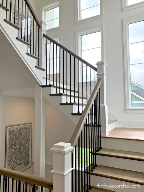 Staircase With Windows, Stair Railings Farmhouse, Black Spindles, Taupe Cabinets, Black Stair Railing, Wood Railings For Stairs, Black And White Stairs, Modern Home Tour, Front Stairs