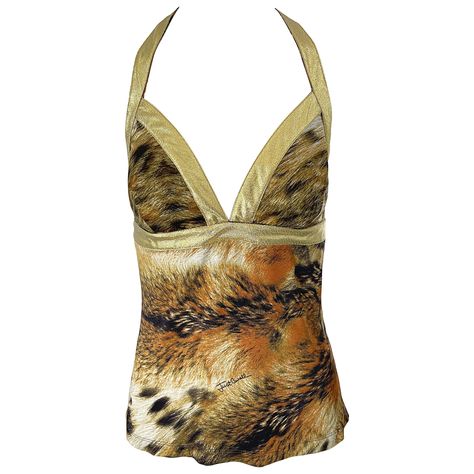 Sexy vintage early 2000s ROBERTO CAVALLI / Just Cavalli lion print and gold lame rayon jersey top ! Features an allover animal print with gold lame straps and racerback. Hidden zipper up the back with hook-and-eye closure. Can easily be dressed up or down. Great with shorts, jeans, a skirt, or trosuers. Would especially look stellar with white denim. In great unworn condition Made in Italy Marked Size Large Measurements: ( has some stretch ) 36 inch bust 32-34 inch waist Tiger Print Outfits, Animal Print Aesthetic, Ramona Badwolf, Vintage Roberto Cavalli, Vintage Blouses, 2000s Outfits, Gold Lame, Lion Print, Racerback Top