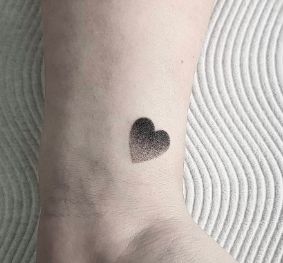 CafeMom.com : Tiny Dotted Heart Tattoo : 50 Perfectly Small Tattoos That Can Be Covered or Shown at Will -- We love this take on a heart by having it totally done in dot work. This design has a bit of an ombré effect, which looks fresh and cool. Imagine this with some smaller hearts beside it to represent children -- so sweet! Tiny Heart Tattoos, Palm Tattoos, Small Girl Tattoos, Cute Small Tattoos, Subtle Tattoos, Small Tattoo Designs, Black Ink Tattoos, Tattoo Trends, Tattoo Pattern