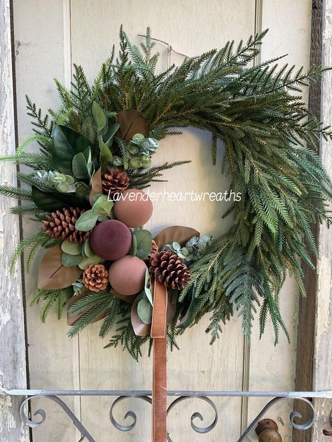 New holiday wreath with real touch greenery, pine cones, magnolia leaves, velvet Christmas bulbs, eucalyptus and a ribbon of your choice. This wreath comes in three sizes 20inches, 22 and 24 inches. Christmas Wreaths With Nativity Scene, Beautiful Wreaths Christmas, Christmas Wreath With Eucalyptus, Christmas Wreath 2024 Trends, Christmas Wreath Minimalist, Fresh Wreath Ideas, Christmas Wreaths Front Door, Christmas Wreath Ideas 2024, Christmas Wreaths 2024