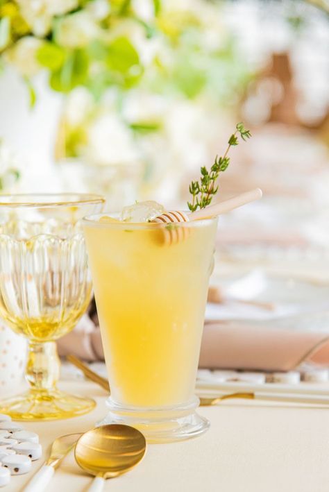 Always match your cocktail to your theme. We couldnt have a bee themed baby shower without a Bees Knees cocktail. Topped with fresh thyme and a min ihoney stir stick! Bee Themed Alcohol Drinks, Bee Themed Cocktails, Honey Bridal Shower Theme, Honey Bee Bridal Shower Ideas, She Found Her Honey Bridal Shower Theme, Bride To Bee Theme, Bride To Bee Bridal Shower Ideas, Honey Themed Party, Bee Wedding Theme