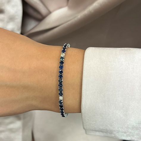 This Beautifully Crafted Tennis Bracelet Features Round Cut Blue Sapphires And Diamonds Encrusted In Four Prong Setting. Crafted In 14k White Gold. Total Diamond Weight: 0.32 Carat. Diamond Quality: G-H Color And Vs-Si Clarity. Total Sapphire Weight: 8.31 Carats. Length: 7 Inches. Width: 3.1mm. Total Weight: 10.88 Grams. Bracelet Closes Securely With A Box Clasp. This Tennis Bracelet Is A Timeless Piece That Holds A Place In The Collection Of Every Jewelry Lover. Comes With A Presentable Gift Bo Sapphire Bangle, Box Clasp, Sapphire Bracelet, Tennis Bracelet, Jewelry Lover, Womens Jewelry Bracelets, Timeless Pieces, A Box, Prong Setting