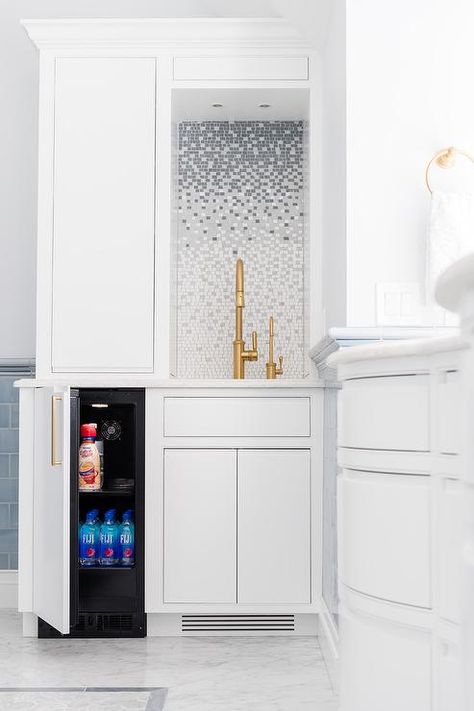 Elegant bathroom coffee station boasts a mini refrigerator concealed behind a white door with a brass pull and positioned beside white flat front cabinets. Hidden Bath, Flat Front Cabinets, Fridge Design, Bathroom Paint Colors, Room Door, Bath Room, Elegant Bathroom, Trendy Kitchen, Mini Fridge