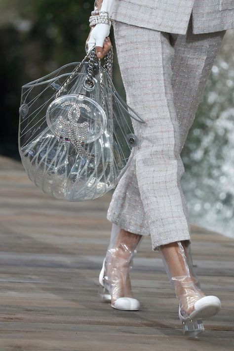 Image Source: Getty / PATRICK KOVARIK Couture, Plastic Boots, Clear Handbags, Clear Tote Bags, Transparent Bag, Chanel Logo, Chanel Shoes, Bucket Hats, Fashion Logo