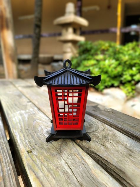 "We are so excited to introduce you to our small pagoda lantern collection! These small lanterns are made with a high quality maple wood, designed originally by us (made from scratch), laser cut and of course finished with passion (already assembled). They are painted with a premium house-blend cherry red & black acrylic paints. Also, they are coated with waterproof and UV protectant top, which make them perfect for outdoor use as well. They come in 3 sizes : Height and Width are proportional  Mini : 4\" inches Small: 5.5\" inches Medium: 7\" inches ⚠ Warning ⚠ \"These lanterns are intended for the use of LED candles only\" LED tealight candle is included with your order. Don't miss out! Buy the set and SAVE $5 If you want to take a look to our bigger style 😉 click on the link:  https://h Chinese Decorations Ideas, Japan Decoration, Small Pagoda, Lantern Japanese, Chinese Style Design, Wooden Lantern, Pagoda Lanterns, Japanese Lantern, Mini Lanterns