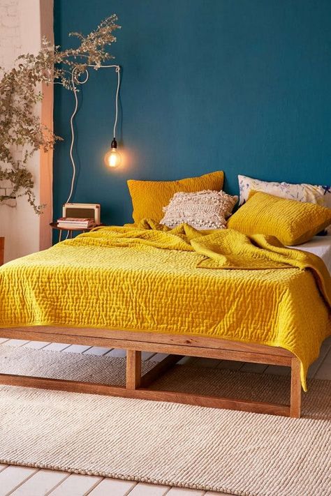 18 Ways to Decorate With the New Ochre Color Trend | Brit + Co Yellow Bedspread, Yellow Room, Yellow Bedroom, Blue Living Room, Blue Bedroom, Awesome Bedrooms, Retro Home Decor, Retro Home, Aesthetic Bedroom