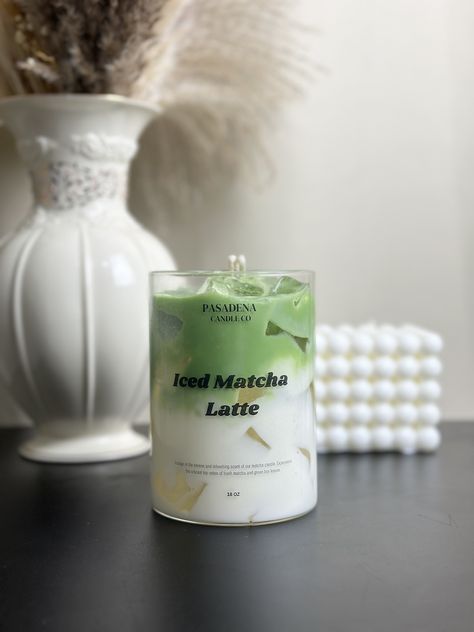 Introducing the Pasadena Candle Co. Iced Matcha Latte Candle, now available for pre-order! This exquisite candle captures the refreshing and invigorating aroma of a perfectly brewed iced matcha latte. Scent Notes: - Top: Fresh Matcha, Green Tea Leaves - Middle: Creamy Milk, Vanilla Bean - Base: Light Honey, Sweet Sugar Immerse your space in the calming and uplifting scent of matcha, creating an atmosphere of tranquility and rejuvenation. Perfect for any occasion, this candle is a must-have for matcha lovers and those who appreciate unique, realistic scents. It also makes the perfect gift for friends, family, or any candle enthusiast. Secure your Iced Matcha Latte Candle today and be the first to enjoy this delightful fragrance! Pasadena Candle Co is a perfect gift store when you think abou Matcha Candle, Latte Candle, Realistic Candles, Drink Candles, Green Candles, Iced Matcha Latte, Gel Candles, Tea Candle, Hand Painted Candles