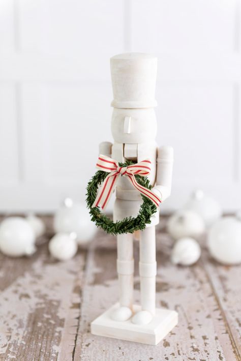 White And Gold Nutcracker Diy, White Christmas Decor Aesthetic, Diy Crate And Barrel Hacks, Elegant Nutcracker Christmas, Modern Nutcracker Decor, Modern Nutcracker Christmas, Wooden Nutcrackers Diy, Hobby Lobby Nutcracker Diy, Painting Nutcrackers Diy