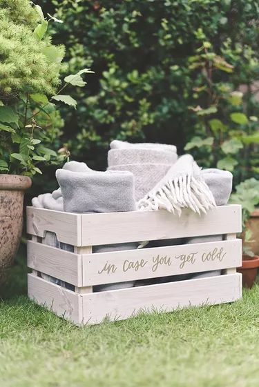 The 25 Most Clever Blanket Storage Ideas | Hunker Rustic Modern Wedding, Craft Fairs Booth, Hanging Hats, Wedding Blankets, Craft Show Displays, Blanket Box, Blanket Storage, Wood Crates, Wooden Wedding