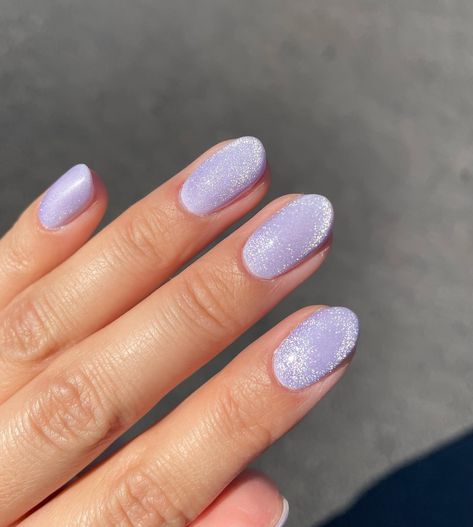 Posted by Zoe Scott: Welcome to the luxurious world of velvet nails, where the fusion of texture and color creates a fashion statement that transcends seasons. Today, we'r... Purple Holographic Nails Designs, Light Purple Glitter Nails, Light Purple Nails With Glitter, Soft Purple Nails, Lavender Haze Nails, Glittery Purple Nails, Speak Now Nails, Purple Cat Eye Nails, Purple Sparkly Nails