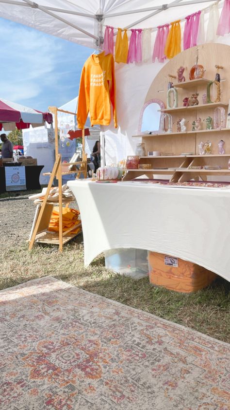 Loving the colors and layout of my booth setup! My new rug is a perfect fit! Booth Inspiration Market Stalls, Vendor Booth Rug, Market Booth Decoration, Simple Craft Show Display, Z Shape Vendor Booth, Pop Up Craft Booth, Colorful Vendor Booth, Vendor Booth Layout, Clothing Vendor Booth Display