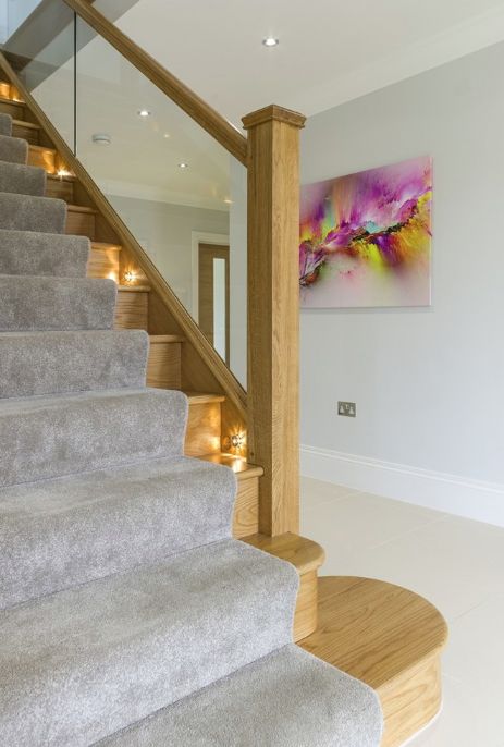 Add lively lighting to your staircase for a unique look. Stair Paneling, Modern Stair Railing, Stair Gallery, Handrail Design, Glass Stairs, Oak Stairs, Narrow Hallway Decorating, New Staircase, Wood Staircase