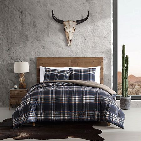 Authentically made with comfort at top of mind, the wrangler bedding collection is crafted using premium microfiber made from 100% polyester. It is ideal for year-round use and gets softer with each wash. Each set includes two matching shams for easy styling. Made thoughtfully and sustainably using non-toxic dyes, with oeko-tex certification. Machine washable for easy care. Complete the look with comforters, quilts, and accessories from wrangler, sold separately# Pieces In Set: 2Included: 1 Duve Plaid Comforter, Blue Comforter Sets, Reversible Bedding, Blue Comforter, Blue Duvet, King Duvet Cover Sets, Twin Comforter, Reversible Duvet Covers, Bedding Stores