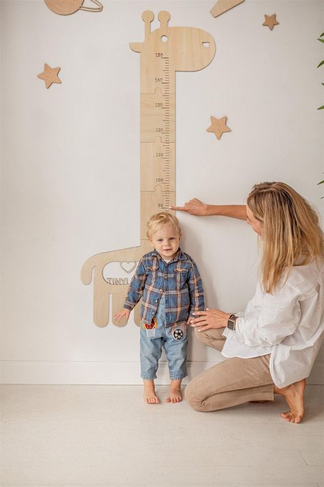 Mark the height chart with a cute giraffe pattern every time you measure your height, and it can be the perfect wall decoration for your kids' room.A child growth chart is made of plywood, safe and non-toxic, waterproof, and durable, so your baby can enjoy healthy and happy growth!Part of the natural beauty of timber is that every piece is different, colours and shades of timber may vary from what is pictured.Please hang the growth chart at 19.06in from the floor to maintain accuracy and facilitate cleaning and prevent accidental kicking. usechatgpt init success Nursery Height Chart, Giraffe Measuring Chart, Giraffe Height Chart, Kids Height Chart Diy, Growth Chart Ideas, Giraffe Baby Room, Animal Growth Chart, Child Growth Chart, Baby Height Chart