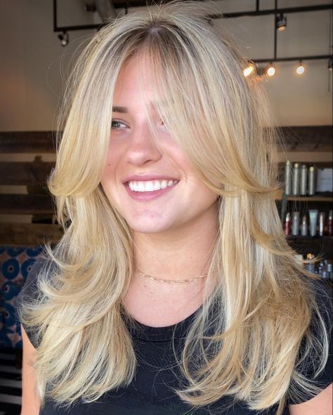 Women with golden blonde hair with curtain bangs and layered haircut Curtain Bangs Long Hair Blowout, Blonde Haircuts Medium Layers, Golden Blonde Layered Hair, Golden Blonde Hair Layers, Blond Layers Medium, Face Framing Layers With Curtain Bangs Medium, Layer Haircut Curtain Bangs, Bouncy Curtain Bangs, Blonde Hair With Curtain Bangs Medium