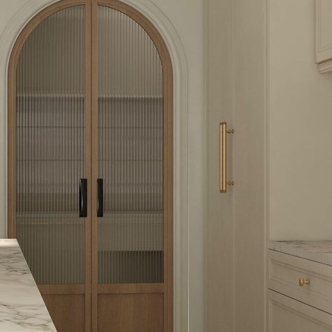 We went through a few designs for this custom door and finally settled on this - an arched pocket door featuring custom stained white oak… | Instagram Arched Pocket Doors Pantry, Stained Pocket Doors, Arch Closet Doors, Fluted Glass Arch Door, Arched Wood Doors Interior, Reeded Glass Pocket Door, Arch Pocket Sliding Door, Reeded Glass Pantry Door, Arch Pocket Door