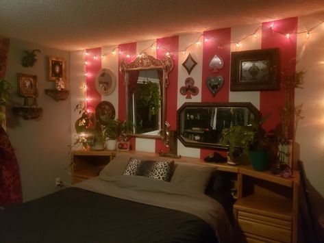 My circus themed bedroom. Blue grey paint on all the walls except 1, done in thick red and white stripes. The wall of mirrors was done entirely with thrift store finds. Clown Bedroom Aesthetic, Clown Themed Room, Circus Room Aesthetic, Circus Home Decor, Roleplay Ideas Bedroom, Clown Bedroom, Circus Theme Room, Burlesque Bedroom, Carnival Bedroom