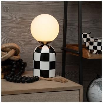 Base Dimensions: 5.75" W x 5.75" D Shade Dimensions: 6" H x 6" W x 6" D Full Height: 12" Cord Length: 60" Bulb Type: B 3W Power Source: Corded Electric Material: Ceramic, Glass & Metal Color: Black, White & Gold Pattern: Check Quantity: 1 Invite a timeless classic into your home with a Checkered Table Lamp. This ceramic lamp features a retro check design and a round bulb on top. The large bulb on top gives this accent a modern twist to an otherwise vintage design. Place it in your living room to Accent Pieces For Bedroom, Hobby Lobby Lamp, Unique Desk Lamp, Electric Decor Style, Cozy Black And White Living Room, Checkered Room Decor, Quirky Home Decor Living Room, Post Modern Decor, Black White And Gold Living Room Ideas