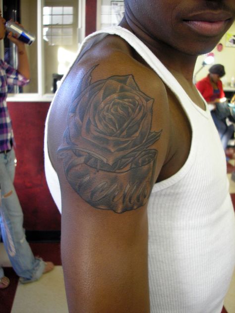 Blair Rose With Banner | Black and Grey rose, the banner say… | Flickr Arm Tattoos For Black Guys, Tattoos For Black Guys, Upper Shoulder Tattoo, Good First Tattoos, Black People Tattoos, Pinterest Tattoo Ideas, Black Men Tattoos, Black And Grey Rose, Rose Shoulder Tattoo