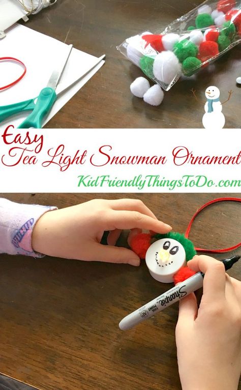 Easy Snowman Tea Light Ornament Craft for the perfect stress free craft with kids! - Great for a classroom party - KidFriendlyThingsToDo.com Snowman Light Craft, Snowmen Tea Lights, Tealight Candle Snowman Ornament, Snowman Tealight Ornament, Snowman Lightbulb Ornament Diy, Kids Crafts Ornaments, Tea Light Snowman, Tea Light Crafts, Christmas Tea Party