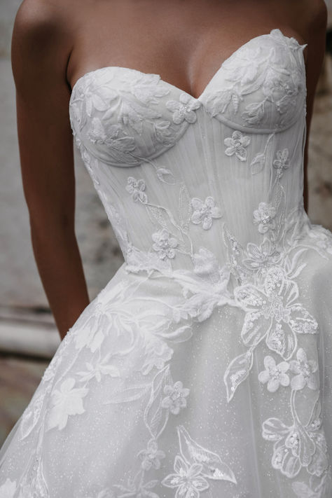 Experience timeless elegance in this strapless floral lace wedding gown. The intricate lace detailing adds a touch of romance, while the fitted bodice accentuates your figure beautifully. Perfect for brides looking for a classic yet sophisticated look on their special day. #weddingdress #florallace #straplessgown #bridalfashion #romanticbride #classicbride #weddinginspiration #elegantbride Small Wedding Dress Ideas, Corset Bridal Dress, Girly Wedding Dress, Pretty Wedding Dresses, Wedding Dresses Corset, Dream Wedding Ideas Dresses, Elegant Bride, Allure Bridal, Wedding Gowns Lace