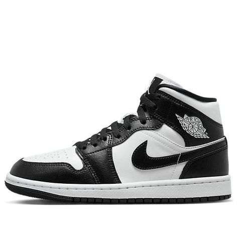 The Air Jordan 1 Mid 'Panda' is a stylish and comfortable sneaker for adults. The classic silhouette has been enhanced with a supportive upper and a slip-resistant outsole. The black and white colorway is perfect for any occasion, from casual days out to a night on the town. The sneaker is inspired by the classic Jordan 1 series, offering a timeless look that will never go out of style. Pandas, Black And White Jordans, Jordan Mid, Wmns Air Jordan 1, Jordan 1 Black, Retro Basketball Shoes, White Jordans, Black Jordans, Nike Air Jordan 1 Mid