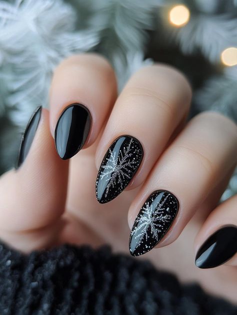 Indulge in the allure of 19 chic black Christmas nail ideas that prove dark can be merry. These designs offer a stylish alternative to traditional festive colors, blending holiday motifs with edgy elegance. Learn how to incorporate glitter, metallic accents, and intricate patterns for a unique and eye-catching seasonal manicure. Black Winter Nails Short, Yule Nails Winter, Non Traditional Christmas Nails, Alternative Christmas Nails, Minimalist Holiday Nails, Edgy Christmas Nails, Yule Nails, Dark Christmas Nails, Black Christmas Nail Designs