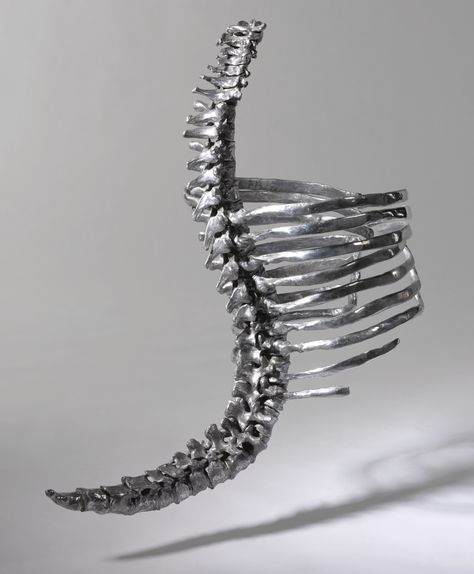 Skeleton Corset, Shaun Leane Polished aluminum with black leather neck and waist straps, hinged ribcage sections, length 25 inches. Created for Alexander McQueen's 'Untitled' Collection, Spring/Summer 1998. Savage Beauty, Metropolitan Museum of Art, 2011 and Victoria & Albert Museum, 2015. Photographed by Tim Walker for British Vogue, March 2015.  Anglomania, Tradition & Transgression in British Fashion, Metropolitan Museum of Art, 3 May - 4 September, 2006.  ‘Lee said he knew what he wanted for Skeleton Corset, Shaun Leane, Claw Earrings, Philip Treacy, Body Adornment, Jewelry Auction, Fantasias Halloween, Silver Crown, British Vogue