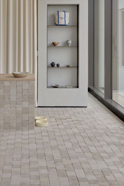 Limestone Pendell cobbles are a stylish addition to modern interior designs, offering cream-coloured tones with beautiful variations in shade. Perfect for home gardens, outdoor living spaces, or courtyard inspiration, these create a cohesive flow from floor to wall. Use them to add a highlight feature in powder rooms, laundry rooms, and mudrooms, or as part of facades, villas, and hotels. Their natural aesthetic suits contemporary architecture and Australian homes. #EcoOutdoor Courtyard Inspiration, Aesthetic Suits, Eco Outdoor, Mediterranean House, Home Gardens, Mediterranean Architecture, Mediterranean Style Homes, Natural Stone Flooring, Natural Aesthetic