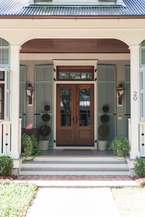 Front Foor, Shutters Around Front Door, Exterior Shutters Flanking Front Doors, Lantation Shutters For Front Door, House With Bahama Shutters, Houses With Bahama Shutters Exterior, Arched Louvered Doors, Outside Fall Decor, Beach House Exterior