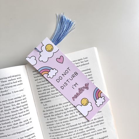 This cute bookmark is perfect for gifting to book lovers or keeping for yourself! Bookmarks are designed by me and printed in the UK, made from FSC® certified 400gsm card. They have gloss lamination to the front, and a silk finish on the reverse. Bookmarks measure 5.4 x 15.5 cm. Tassels are optional, if you choose the 'no tassel' option there will be no hole.  Bookmarks are carefully packaged in recyclable glassine pouches and posted in a board-backed envelope to ensure they arrive in perfect co Cute Bookmarks Ideas, Easy Bookmark Ideas Simple, Good Vibes Book, Cute Bookmarks Handmade, Cute Bookmark Ideas, Bookmark Ideas Aesthetic, Bookmarks Aesthetic, Rainbow Bookmark, Bookmark Aesthetic