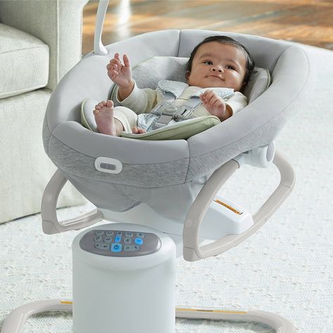 The Graco® Soothe My Way™ Baby Swing with Removable Rocker features 8 soothing motions in 2 directions, for 16 ways to soothe baby. The 2-in-1 design offers a swing seat that doubles as a removable rocker for use throughout the home. Plush fabrics and a removable body support provide added comfort for your little one. The multi-directional seat allows baby to swing facing front, right, or left, for the most soothing options. A 5-point harness keeps baby secure. 6 swinging speeds allow parent to Crib Hammock Baby, Amazon Baby Room, Baby Bouncer Seat, Graco Baby, Baby Gadgets, Baby Swing, Baby Bouncer, Baby Necessities, Baby Swings