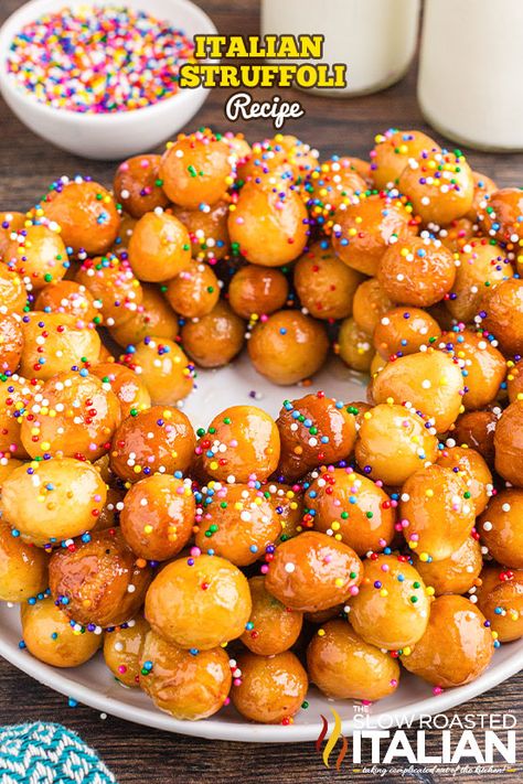 This struffoli recipe is the perfect holiday treat! Make crispy Italian honey balls with fresh oranges, pantry staples, and colorful sprinkles. Italian Christmas Dessert Recipes, Struffoli Recipe, Honey Balls, Italian Christmas Desserts, Slow Roasted Italian Recipes, Easy Tiramisu Recipe, Slow Roasted Italian, Italian Cream Cakes, Italian Recipes Dessert