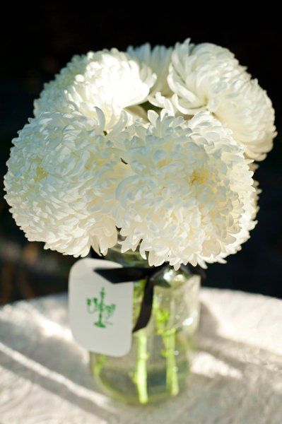 white mason jar centerpiece    {Simply Couture Weddings LLC} Football Mums, Mason Jar Centerpiece, Chrysanthemum, Mason Jar, Photo Album, Clear Glass, Football, Flowers, White