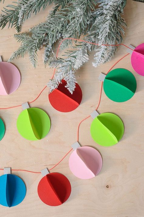 Kids will love to make make this simple DIY paper Christmas ornament garland this holiday! #ad @aleenesdiy Diy Paper Crafts Decoration Christmas, Christmas Diy Ideas Paper, Christmas Tree Out Of Paper On Wall, Christmas Crafts Hanging, Christmas Decor Diy For Kids, Origami Christmas Garland, Christmas Decor Ideas Diy How To Make, Kids Garland Diy, Paper Tree Decorations Christmas