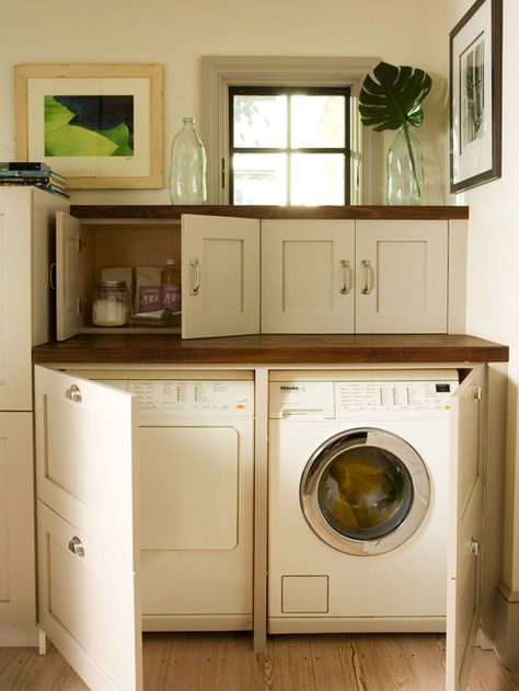 Well-planned laundry space tucked into a kitchen corner is concealed by using matching cabinetry to blend in. Bench Shelf, Laundry Room Decorating, Hidden Laundry, Laundry Room/mud Room, Room Bench, Laundry Closet, Small Laundry Room, Small Laundry, Laundry Room Storage