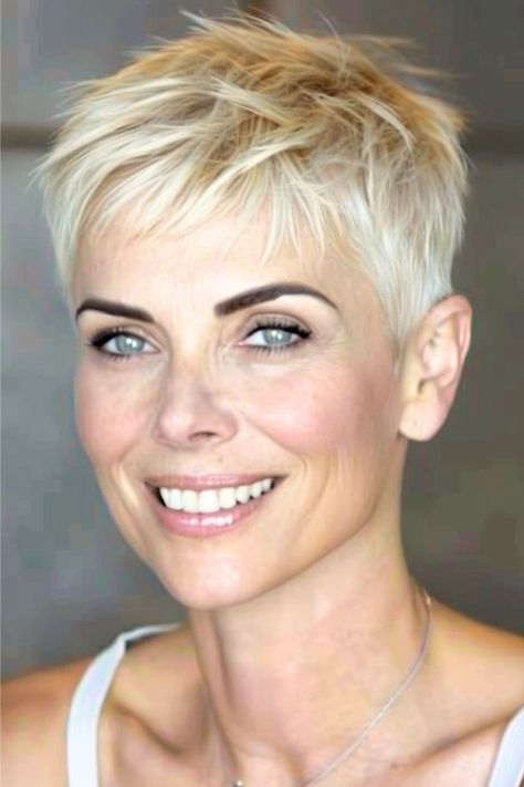 This cropped pixie cut is the epitome of edgy sophistication with its choppy layers that add volume and texture to fine hair.  Click here to see more stunning short hairstyles for women over 50 with fine hair. Short Cropped Hair, Short White Hair, Short Spiked Hair, Short Hairstyles Fine, Crop Hair, Very Short Haircuts, Short Hair Pixie Cuts, Twitter Artist, Messy Short Hair