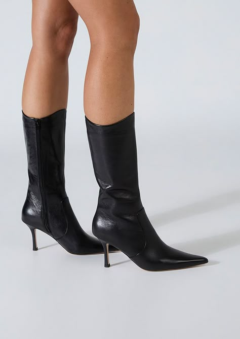 Sheba has a pointed toe and slender heel, creating a sleek silhouette, exuding timeless grace. The distinctive curved opening adds a touch of modernity, making these boots a stand out choice for any occasion. Crafted with precision and style, these calf boots will effortlessly elevate your look. -Material: Leather -Sole: Man-Made -Fit: True to Size -Toe-shape: Point -Features: Curved Opening -Heel: 8cm Leg Height x Calf Circumference x Opening Circumference 5 - 269mm x 318mm x 318mm 5.5 - 273mm Point Toed Boots, Pointed Boots Outfit, Mid Calf Boots Outfit, Calf Boots Outfit, Black Stiletto Boots, Heels Boots Outfit, Pointy Boots, Fall Heels, Thigh High Boots Flat