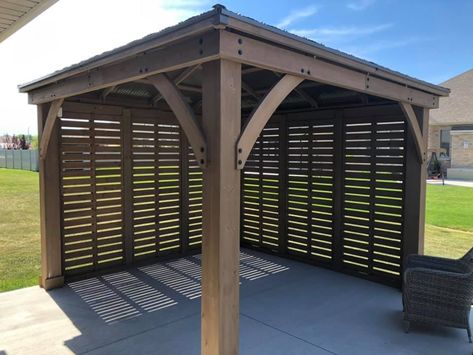 Yardistry's 12 ft. Privacy Wall is the perfect complement to your existing Yardistry 12 x 12, 12 x 14 or 12 x 16 Wood Gazebo with Aluminum Roof. Whether you’re looking for some shade, protection from the wind, or a little privacy, Yardistry’s unique privacy wall design has you covered. Pergola Wind Break, Gazebo With Privacy Screen, Privacy Gazebo Ideas, Diy Pergola Privacy Wall, Covered Deck With Privacy Wall, Gazebo Privacy Wall Ideas, Hot Tub Pergola Ideas Privacy Walls, Patio Cover With Privacy Wall, Gazebo Enclosure Ideas