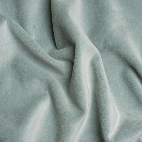 Soften your space with this pastel Banton Breeze Cotton and Polyester Upholstery Velvet. Luxe interiors begin with velvet, a textile equal in modern sophistication as comfort. The muted, light sea-blue face brings this cotton and polyester fabric down to earth, displaying a digestible color ideal for blending with other textures, colors, and design styles.  Featuring a soft face, modest luster, and supple drape, you can easily elevate your home with tufted headboards, throw pillows, and armchair Seafoam Green Fabric, Soft Fabric Texture, Tufted Headboards, Green Velvet Fabric, Elegant Bohemian, Soft Face, Blue Face, Pale Aqua, Mood Fabrics