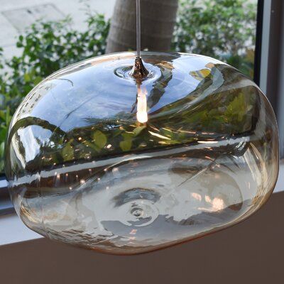 The hand-blown glass pendant features a beautiful asymmetrical irregular shape that offers an organic beauty inspired by nature. The unique glass formations create a large style of pendant lighting resembling a cloud. Ideal for large spaces and high ceilings. Size: 5" H x 10" W x 8" D, Canopy Finish: Polished Nickel | Galilee Lighting Cloud 1 - Light Single Globe Pendant in Amber Glass in Gray, Size 2.0 H x 5.0 W x 5.0 D in | Wayfair Organic Beauty, Pendant Lighting, Lighting Cloud, High Ceilings, Globe Pendant, Island Lighting, Inspired By Nature, Glass Pendant, Clear Glass